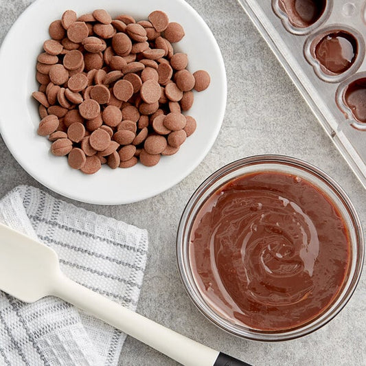 Callebaut Recipe 823 Milk Chocolate Callets™ 22 lb. - 2/Case