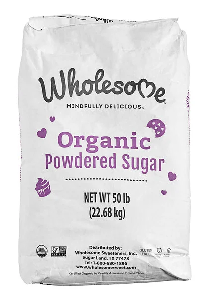 Fine white organic powdered sugar in a glass bowl